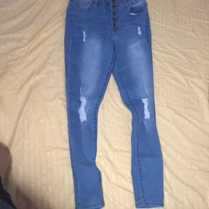 Ripped high rise light wash jeggings.